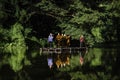 Monks come to offer alms by coming through the water by punting on bamboo rafts along the river at O Ã¢â¬â¹Ã¢â¬â¹Poi Market